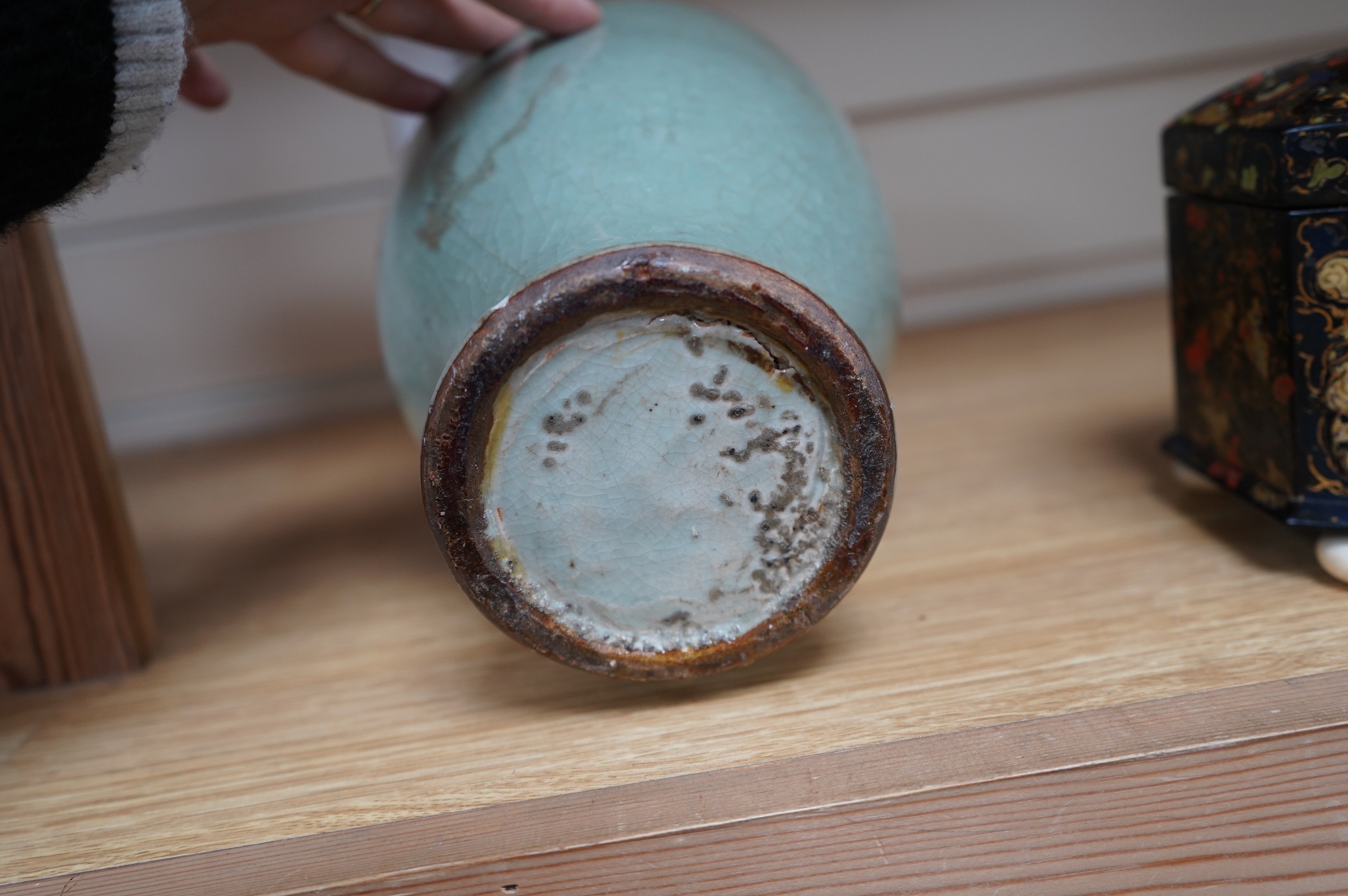A 17th century Chinese celadon crackle glazed vase, 29cm. Condition - ground down